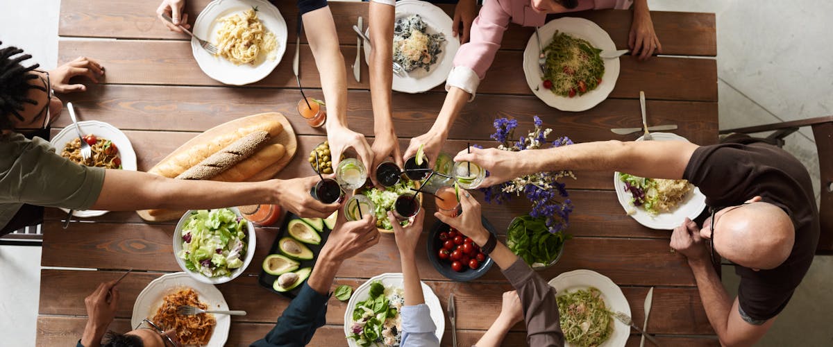 Restaurant staff clearing and resetting a table efficiently